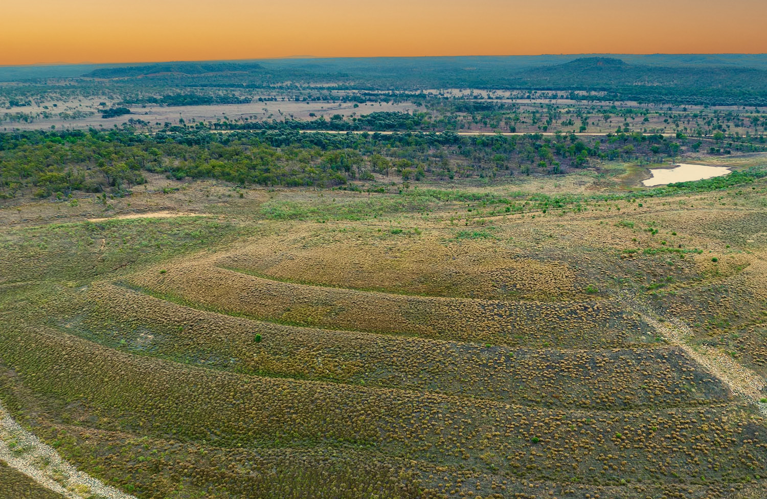 Aerial view of the Newlands Mine Closure rehabilitation area at sunset.