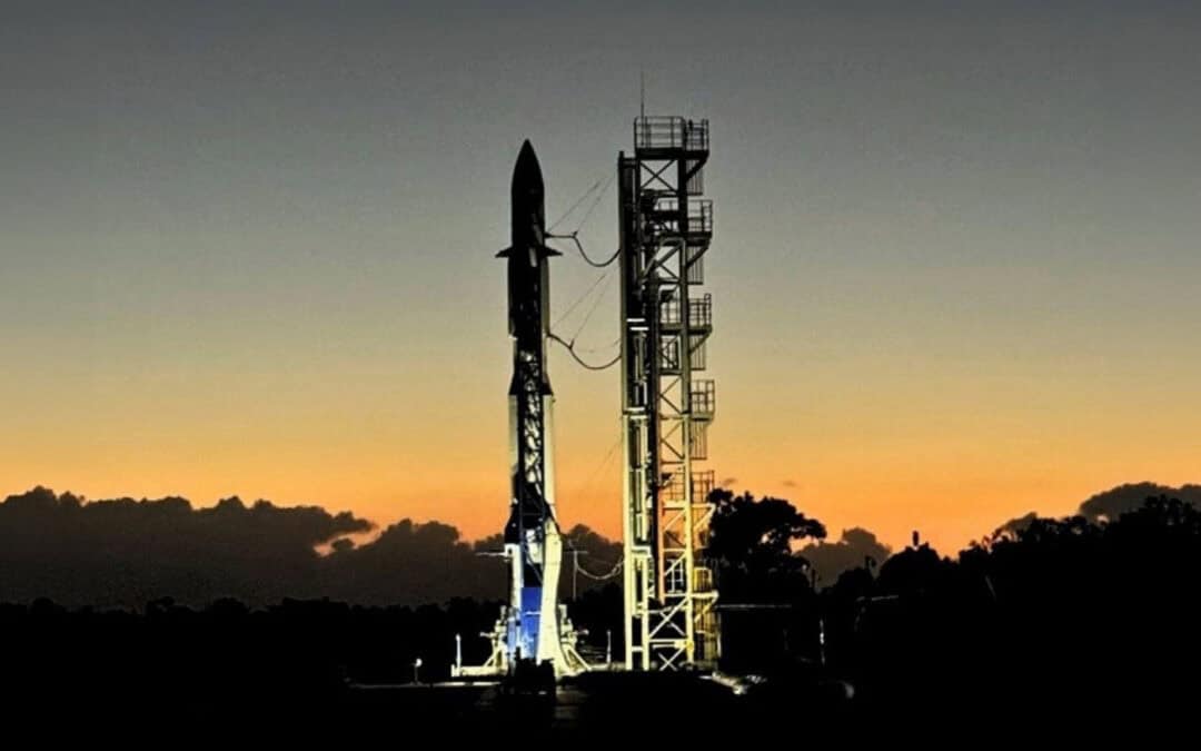 Launch vehicle on a pad at during sunrise.