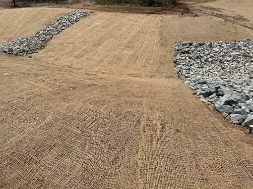 Constructed rock-lined drainage channel and earthworks at Havilah Station.