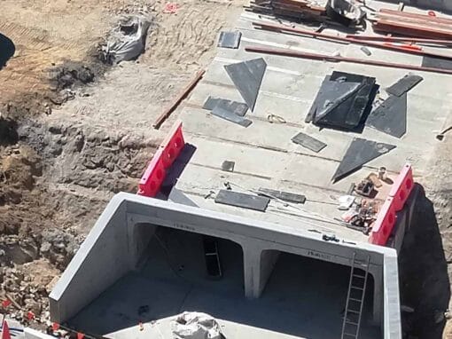Installation of precast concrete culverts during the Etty Bay Road Crossing Upgrade.