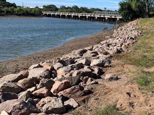 Ross River bank at Oonoonba after rehabilitation works, showing completed rock armouring and stabilisation.