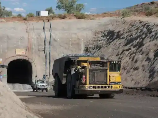 Haul truck operating within the Dugald River Mine site near processing infrastructure.